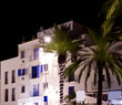 Ibiza white houses in night with palm trees Ibiza white houses in night with palm trees