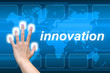 hand pushing innovation button on a touch screen interface