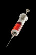 Old glass syringe and vaccine