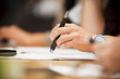 Hand with a pen