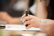 Hand with a pen