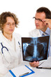 Two doctors looking an x-ray image Two doctors looking an x-ray image