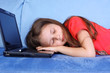 Foto: tired girl sleeping at the PC tired girl sleeping at the PC