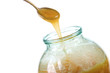 taking the honey with a spoon from the jar taking the honey with a spoon from the jar