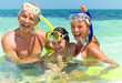 Happy family with snorkels having fun