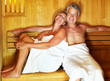 Foto: Happy middle aged couple enjoying a hot sauna Happy middle aged couple enjoying a hot sauna