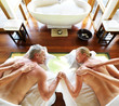Romantic couple on a spa holiday having a back massage