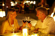 Photo: Mature couple enjoying candlelight dinner in a restaurant Mature couple enjoying candlelight dinner in a restaurant