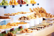 Catering buffet food in restaurant with dessert and fresh fruits
