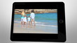 tablet displaying videos about family having fun