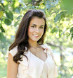 Portrait of smiling beautiful girl in the autumn morning park
