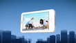 Smartphone showing a family building a sandcastle