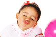 Funny little girl giving a kiss