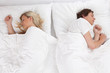 Couple sleeping in bed