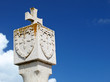 Stone cross on the top of an old church