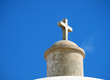 Stone cross on the top of an old church
