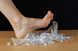 Foot and broken glass