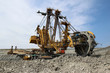 Photo: huge yellow overbuden excavator in brown coal mine huge yellow overbuden excavator in brown coal mine
