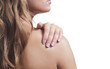 Photo: A close up of a beautiful women rubbing her bare shoulder. A close up of a beautiful women rubbing her bare shoulder.