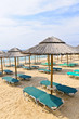 Photo: Beach umbrellas on sandy seashore Beach umbrellas on sandy seashore