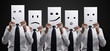 Five business men holding a card with emotional face