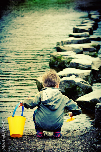 Photo: Child playing at the River Child playing at the River