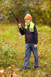 Boy playing with toy shotgun