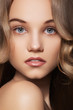 Beautiful girl model with natural makeup, shiny wavy hair