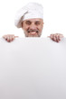 Chef Holding a Sign