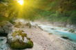 Foggy turquoise mountain brook in sunrise light. Foggy turquoise mountain brook in sunrise light.