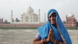 Indian Woman wearing Sari in front of Taj Mahal Indian Woman wearing Sari in front of Taj Mahal