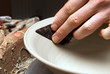 hands of a potter, creating an earthen jar on the circle hands of a potter, creating an earthen jar on the circle