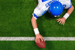Overhead American football player one handed touchdown