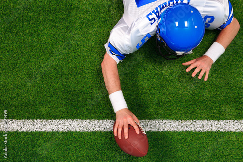 Photo: Overhead American football player one handed touchdown Overhead American football player one handed touchdown