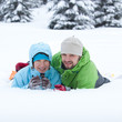 Portrait of the hikers lying in snow