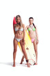 Two Sexy Summer Girls with a Surfboard