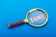 Unemployment concept with magnifying glass