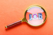Unemployment concept with magnifying glass