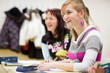 pretty, female college student sitting in a classroom full