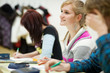 pretty, female college student sitting in a classroom