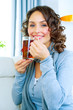 Beautiful Young Woman drinking hot tea