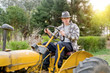 man working on his tractor man working on his tractor