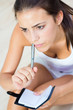 portrait of beautiful woman whit notebook at home