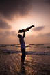 the silhouette of happy family on the beach