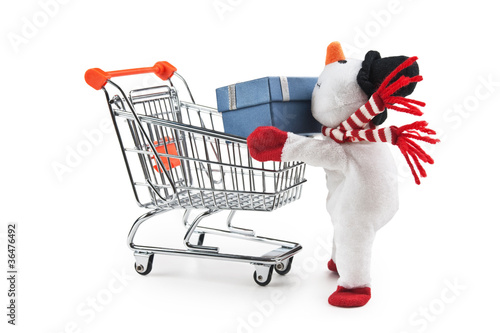 Photo: toy snowman and shopping cart isolated toy snowman and shopping cart isolated