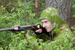 Photo: The shooter in camouflage with an old gun The shooter in camouflage with an old gun