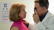 Optometrist checking his patient Optometrist checking his patient