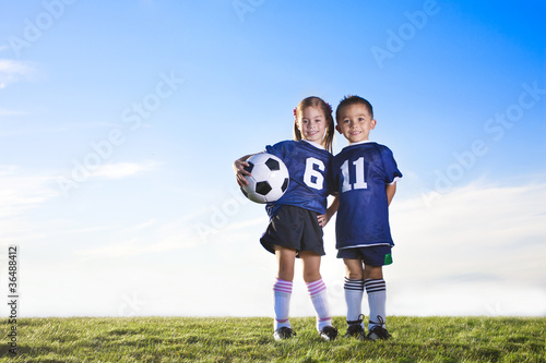 Photo: Cute youth soccer players wearing their team uniforms Cute youth soccer players wearing their team uniforms