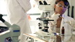 Lab Tech Pouring Liquid in Test Tube dolly shot