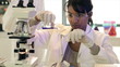 Lab Tech Pouring Liquid in Test Tube